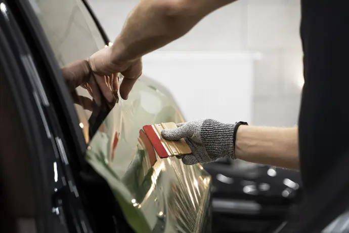 Person wrapping car